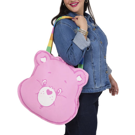 Officially licensed Care Bears Cheer Bear shaped large canvas pink tote bag with vibrant rainbow striped shoulder straps and a printed character face