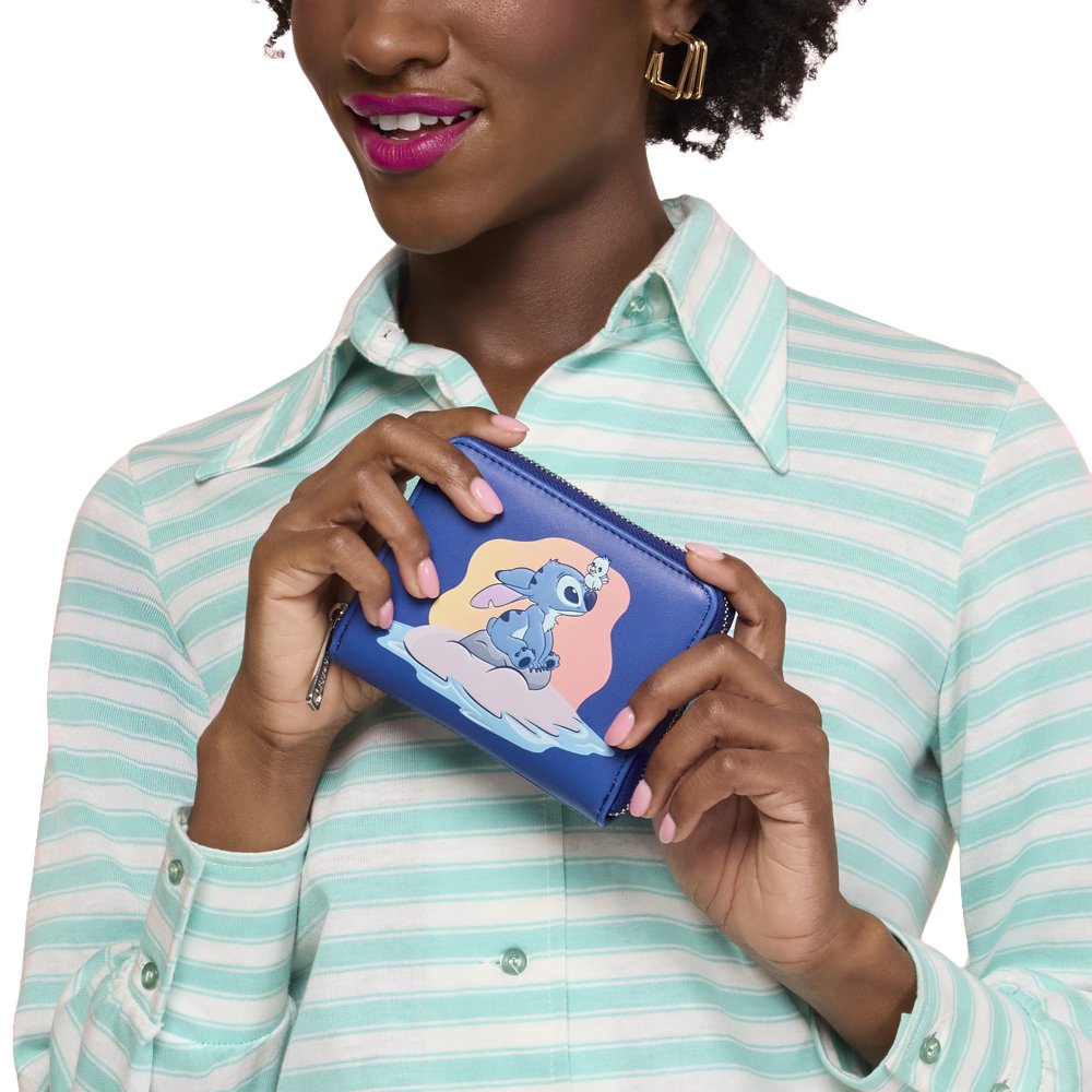 Officially licensed Disney Lilo & Stitch zip-around wallet in navy blue featuring a graphic of Stitch and a small bird sitting on a tropical island