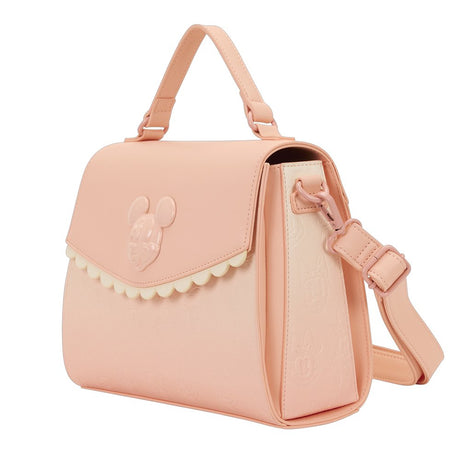Officially licensed Disney Mickey Mouse & Friends light pink-colored tote crossbody bag featuring a 3D character emblem, scalloped trim, and embossed character patterns