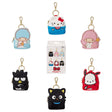 A collection of six Sanrio Backpack Charm Blind Box Keychains, featuring Hello Kitty, Pochacco, Chococat, Kiki, Lala, and Badtz-Maru