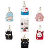 A collection of six Sanrio Backpack Charm Blind Box Keychains, featuring Hello Kitty, Pochacco, Chococat, Kiki, Lala, and Badtz-Maru