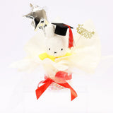 An officially licensed Class of 2026 Miffy graduation gift set featuring yellow, orange, green, and blue color Miffy plush and Boris plush wearing black graduation caps. The characters are arranged like a bouquet with silver star balloons and "Congrats Grad" decorations.