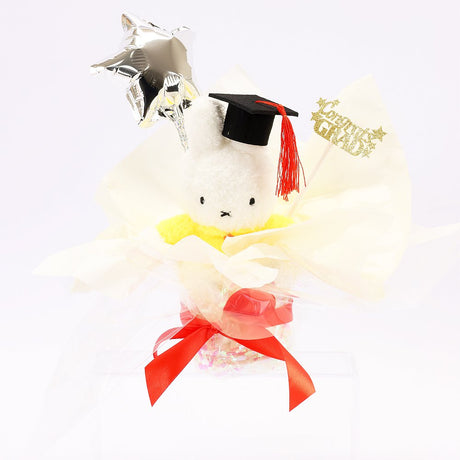 An officially licensed Class of 2026 Miffy graduation gift set featuring yellow, orange, green, and blue color Miffy plush and Boris plush wearing black graduation caps. The characters are arranged like a bouquet with silver star balloons and "Congrats Grad" decorations.