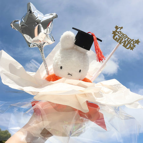 An officially licensed Class of 2026 Miffy graduation gift set featuring Miffy plush wearing black graduation cap. The character is arranged like a bouquet with silver star balloon and "Congrats Grad" decoration.
