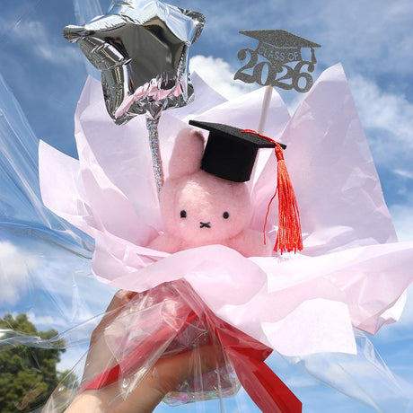 An officially licensed Class of 2026 Miffy graduation gift set featuring Miffy plush wearing black graduation cap. The character is arranged like a bouquet with silver star balloon and "Class of 2026" decoration.
