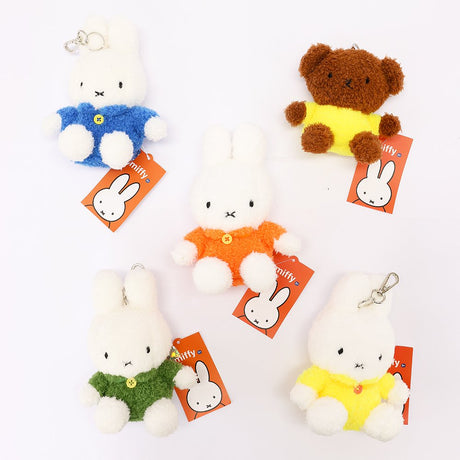 An officially licensed Class of 2026 Miffy graduation gift set featuring yellow, orange, green, and blue color Miffy plush and Boris plush wearing black graduation caps. The characters are arranged like a bouquet with silver star balloons and "Congrats Grad" decorations.
