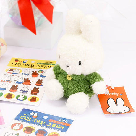 An officially licensed Class of 2026 Miffy graduation gift set featuring yellow, orange, green, and blue color Miffy plush and Boris plush wearing black graduation caps. The characters are arranged like a bouquet with silver star balloons and "Congrats Grad" decorations.