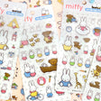 Four different officially licensed Miffy Epoxy Daily Sticker sheets, each featuring various colorful illustrations of the white bunny character and her animal friends. The stickers have a smooth, raised epoxy texture and depict playful scenes like Miffy riding a bicycle, sitting with a giraffe, and boating with a bear.
