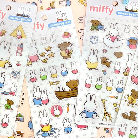 Four different officially licensed Miffy Epoxy Daily Sticker sheets, each featuring various colorful illustrations of the white bunny character and her animal friends. The stickers have a smooth, raised epoxy texture and depict playful scenes like Miffy riding a bicycle, sitting with a giraffe, and boating with a bear.
