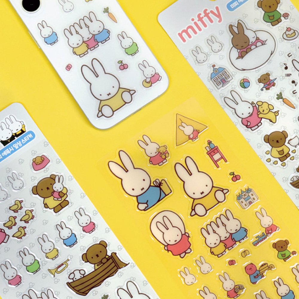 Four different officially licensed Miffy Epoxy Daily Sticker sheets, each featuring various colorful illustrations of the white bunny character and her animal friends. The stickers have a smooth, raised epoxy texture and depict playful scenes like Miffy riding a bicycle, sitting with a giraffe, and boating with a bear.
