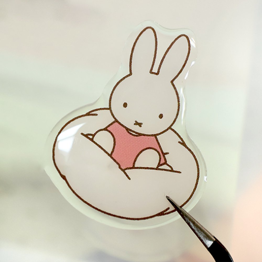 Four different officially licensed Miffy Epoxy Daily Sticker sheets, each featuring various colorful illustrations of the white bunny character and her animal friends. The stickers have a smooth, raised epoxy texture and depict playful scenes like Miffy riding a bicycle, sitting with a giraffe, and boating with a bear.

