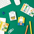 Officially licensed Miffy sticky note booklets featuring different covers—one showing Miffy holding a tray of orange flowers on a white background, and the other showing Miffy eating with a blue spoon on a yellow background