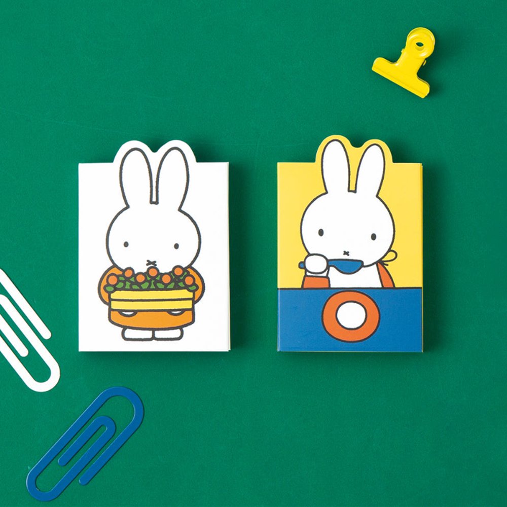Officially licensed Miffy sticky note booklets featuring different covers—one showing Miffy holding a tray of orange flowers on a white background, and the other showing Miffy eating with a blue spoon on a yellow background