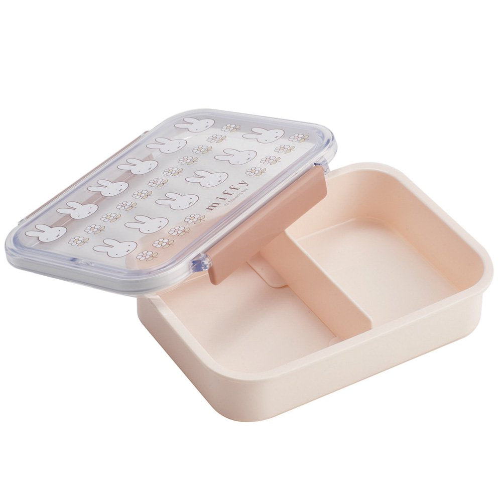An officially licensed Miffy bento lunch box including a divider with a cream-colored base and dusty rose locking clips