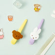 Officially licensed Miffy salon-style big hair clips, featuring one in pastel purple with a white Miffy bunny charm, and the other one in pastel yellow with a brown Boris Bear charm.