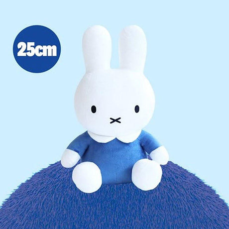 Official Miffy sitting plush wearing a classic blue dress. This pure white minimalist doll is designed for adult collectors seeking childhood nostalgia and visual rest. Its stable sitting posture makes it a perfect soothing desktop companion or a nostalgic shelf decor piece for a high-stress modern lifestyle