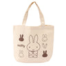 An officially licensed Miffy canvas tote bag in a cream color, showing various Miffy poses and carrots in brown ink.