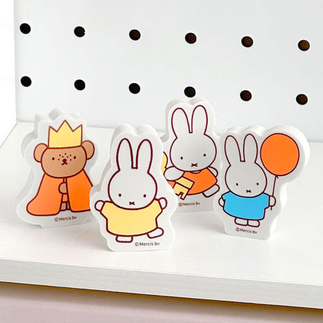 A set of four officially licensed Miffy and Friends shaped erasers standing. The set includes Miffy in yellow and blue outfits, one holding a balloon, and Boris Bear wearing a crown and orange cape.