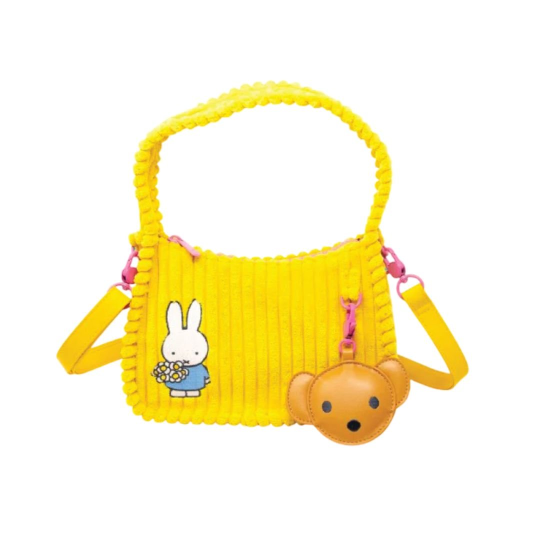 Officially Licensed Yellow Corduroy Miffy Shoulder Bag with strap and top handle. The front features a patch with "miffy & Whatever!" and embroidered flowers, while the back has an embroidered image of Miffy holding flowers and a hanging brown bear PU keychain charm. Ideal Miffy collector's item or novelty handbag