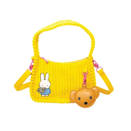 Officially Licensed Yellow Corduroy Miffy Shoulder Bag with strap and top handle. The front features a patch with "miffy & Whatever!" and embroidered flowers, while the back has an embroidered image of Miffy holding flowers and a hanging brown bear PU keychain charm. Ideal Miffy collector's item or novelty handbag