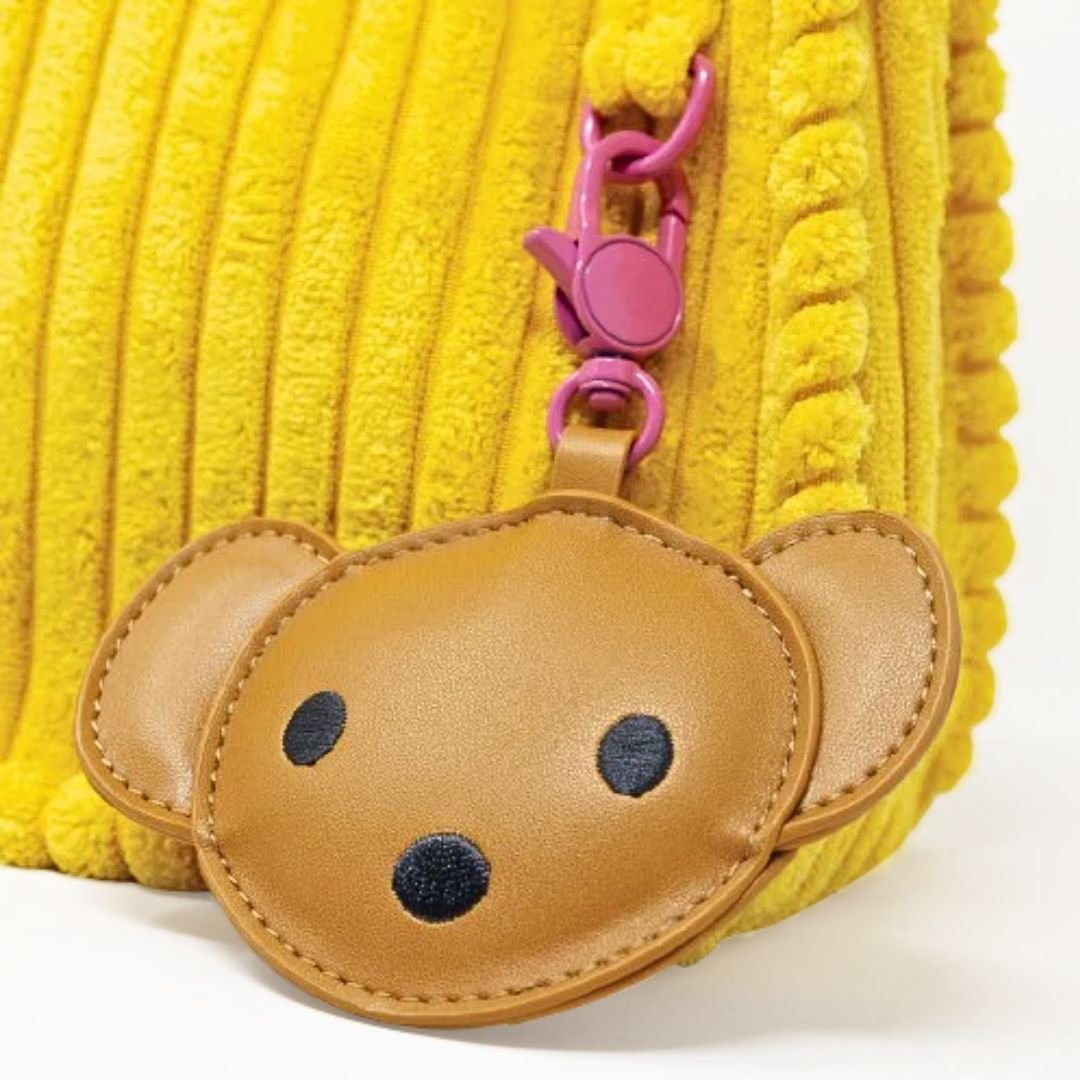 Brown bear-shaped keychain attached to a Yellow Corduroy Miffy Shoulder Bag 