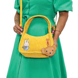 Officially Licensed Yellow Corduroy Miffy Shoulder Bag with strap and top handle. The front features a patch with "miffy & Whatever!" and embroidered flowers, while the back has an embroidered image of Miffy holding flowers and a hanging brown bear PU keychain charm. Ideal Miffy collector's item or novelty handbag