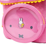 Officially licensed pink corduroy Miffy backpack. The front panel has a circular window pocket with Miffy's face, and the top flap is shaped like rabbit ears with a scalloped yellow trim.