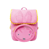 Officially licensed Miffy backpack in pink corduroy. The front features Miffy's face on a round clear window pocket, and the flap is shaped like bunny ears with yellow trim. 