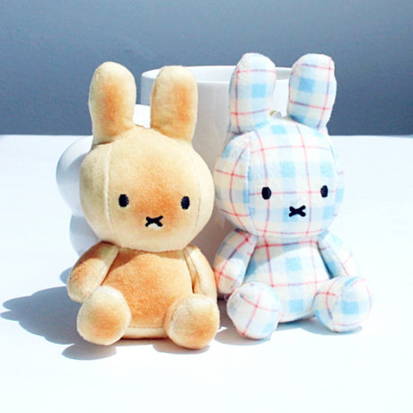 Collectible Miffy plush keychains. Includes a unique Bread/Toast-themed Miffy doll and a blue plaid Miffy doll. Both plush toys feature signature Miffy embroidery and are perfect for bag accessories.