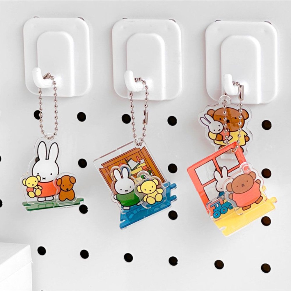 Officially licensed Miffy and Friends acrylic diorama set featuring pop-out characters like Miffy and Boris Bear, colorful scenery pieces, and silver ball chains for keychain use.