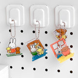 Officially licensed Miffy and Friends acrylic diorama set featuring pop-out characters like Miffy and Boris Bear, colorful scenery pieces, and silver ball chains for keychain use.