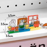 Officially licensed Miffy and Friends acrylic diorama set featuring pop-out characters like Miffy and Boris Bear, colorful scenery pieces, and silver ball chains for keychain use.