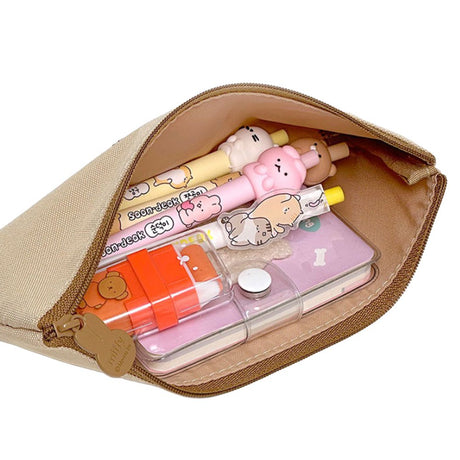 Two slim canvas pencil cases: one grey featuring an embroidered Miffy face and one tan featuring Boris Bear. Both cases have character-shaped zipper pulls.