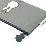 Two slim canvas pencil cases: one grey featuring an embroidered Miffy face and one tan featuring Boris Bear. Both cases have character-shaped zipper pulls.