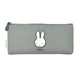 Two slim canvas pencil cases: one grey featuring an embroidered Miffy face and one tan featuring Boris Bear. Both cases have character-shaped zipper pulls.