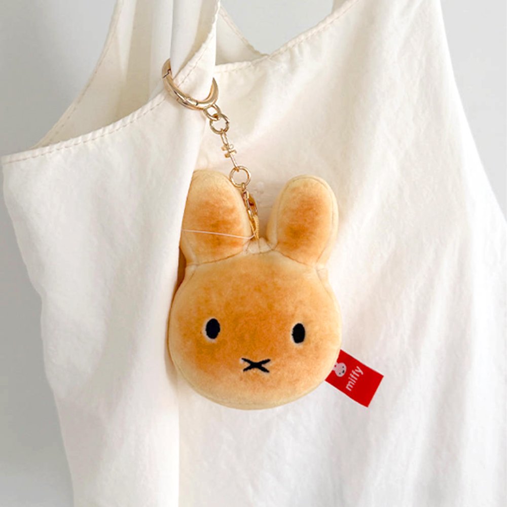 An officially licensed Miffy golden-brown bread plush charm keychain with embroidered eyes