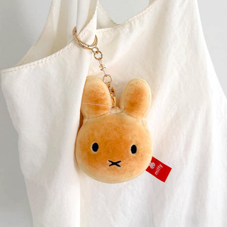 An officially licensed Miffy golden-brown bread plush charm keychain with embroidered eyes