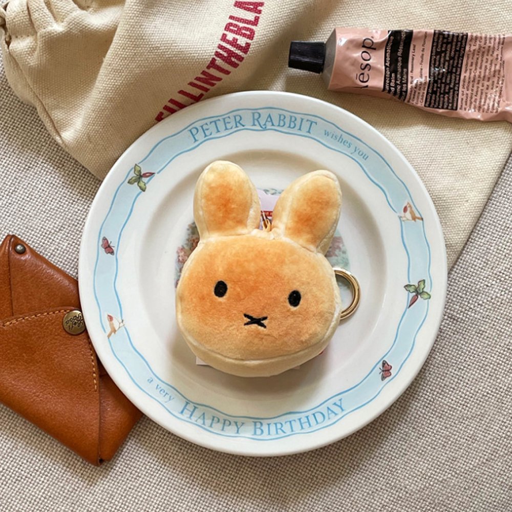 An officially licensed Miffy golden-brown bread plush charm keychain with embroidered eyes