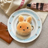 An officially licensed Miffy golden-brown bread plush charm keychain with embroidered eyes