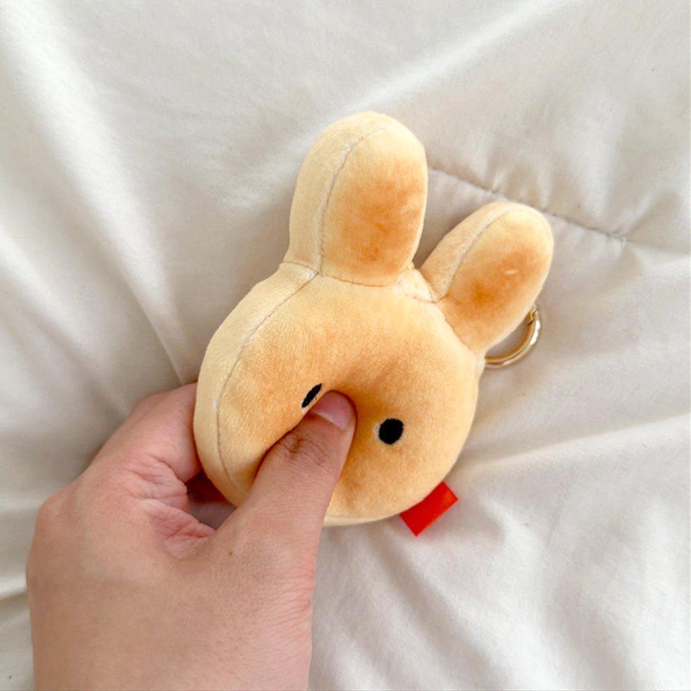 An officially licensed Miffy golden-brown bread plush charm keychain with embroidered eyes