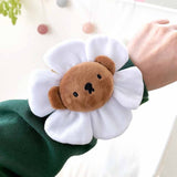 A collection of Miffy Friends Flower Plushies stuffed animals in various colors, each designed to look like a flower with animal faces in the center.