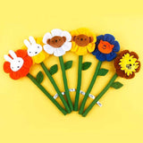 A collection of Miffy Friends Flower Plushies stuffed animals in various colors, each designed to look like a flower with animal faces in the center.
