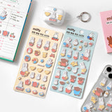 Two officially licensed Miffy Fuzzy Cushion Sticker sheets in cream and mint colors, showcased alongside a decorated phone case and earbud case. The sticker sheets are filled with small, textured, raised stickers depicting Miffy the bunny and her friends engaging in daily activities like baking and gardening.
