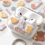 Two officially licensed Miffy Fuzzy Cushion Sticker sheets in cream and mint colors, showcased alongside a decorated phone case and earbud case. The sticker sheets are filled with small, textured, raised stickers depicting Miffy the bunny and her friends engaging in daily activities like baking and gardening.

