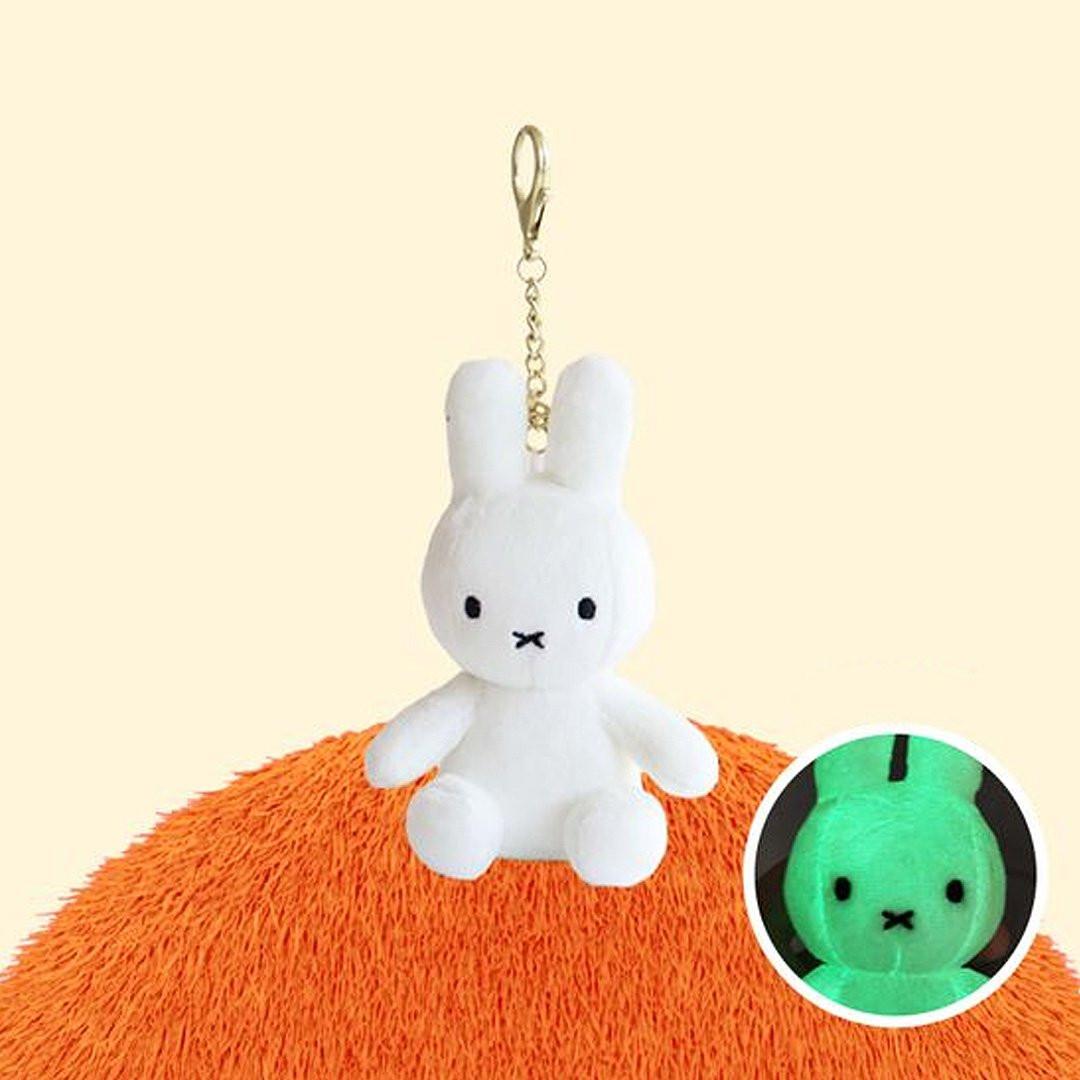 Official Miffy Glow in the Dark Mascot Plush Keychain; a functional white rabbit bag charm with illuminating green embroidery for **night visibility and Y2K aesthetic**. A premium **self-care gift or thoughtful anniversary surprise** for adult collectors and minimalist Zen lovers.