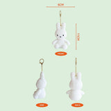 Detailed measurement guide for the Official Miffy Glow in the Dark Mascot Plush Keychain; showing 11cm height and 6cm width dimensions from front, side, and back views. This 11cm white rabbit bag charm is a perfectly sized premium gift for adult collectors, birthdays, and minimalist office-core desk decor.