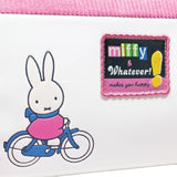 Officially licensed Miffy House-shaped cross-body bag . The bottom PU leather section features a printed or debossed graphic of Miffy riding a bicycle. The top section is pink corduroy, resembling a roof.