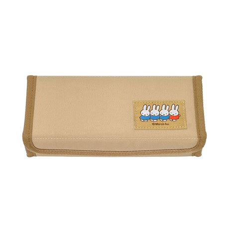 An officially licensed Miffy magnetic pencil case in beige and grey, featuring a colorful embroidered patch of Miffy characters on the front cover.