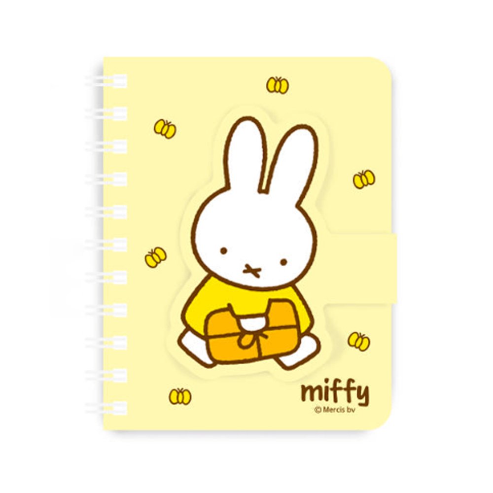 A series of officially licensed Miffy spiral notebooks in pastel pink, blue, and purple, featuring a large magnetic character buckle. The interior shows lined paper with a small Miffy graphic in the bottom corner, highlighting the notebook's functional and cute design.