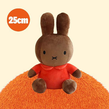 Miffy Melanie Brown plush toy with a red shirt on an orange cushion, with a '25cm' label in the corner.